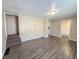 Open living room with staircase access and flow to other living spaces at 274 Leeds Ave, Indianapolis, IN 46201