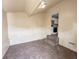 Cozy room with a carpeted floor, neutral walls, that opens to kitchen through small stairs at 274 Leeds Ave, Indianapolis, IN 46201