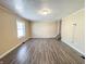 Open living room with new flooring, neutral paint, and a staircase at 274 Leeds Ave, Indianapolis, IN 46201