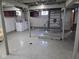 Spacious basement featuring laundry hookups, painted walls, and stairs to the upper level at 2819 W 16Th St, Indianapolis, IN 46222