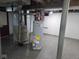 Basement utility area with a furnace, water heater, and durable flooring, ready for your customization at 2819 W 16Th St, Indianapolis, IN 46222