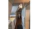 Bathroom with shower, sink, toilet, and gray walls under an interesting vaulted ceiling at 2819 W 16Th St, Indianapolis, IN 46222