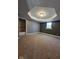 A spacious carpeted bedroom is enhanced by an architectural tray ceiling and closet for storage at 2819 W 16Th St, Indianapolis, IN 46222
