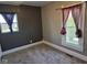 This carpeted bedroom has neutral colors and natural light streaming in through the windows at 2819 W 16Th St, Indianapolis, IN 46222