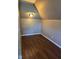 Cozy bedroom with hardwood-look floors, a vaulted ceiling, and a flush-mount light fixture at 2819 W 16Th St, Indianapolis, IN 46222
