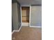 A neutral-toned bedroom features a built-in closet with ample shelving for storage at 2819 W 16Th St, Indianapolis, IN 46222