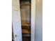 Open closet shows several wooden shelves, perfect for storage and organization at 2819 W 16Th St, Indianapolis, IN 46222
