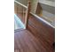 Staircase landing with wooden floors and white railings, leading to additional living spaces at 2819 W 16Th St, Indianapolis, IN 46222