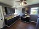 An efficient kitchen provides ample cabinet space and stainless steel microwave and stove at 2819 W 16Th St, Indianapolis, IN 46222