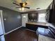 Modern kitchen features dark cabinets, stainless steel appliances, and a ceiling fan at 2819 W 16Th St, Indianapolis, IN 46222