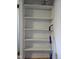 Built-in shelving unit with a fresh coat of white paint, ready for customization and ample storage at 2819 W 16Th St, Indianapolis, IN 46222