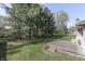This backyard boasts lush greenery and a cozy patio, perfect for relaxing outdoors at 3427 Brunswick Ave, Indianapolis, IN 46227