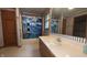 Full bathroom featuring single sink vanity, bathtub, nautical themed shower curtain and decor at 3427 Brunswick Ave, Indianapolis, IN 46227