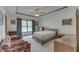 Cozy bedroom featuring neutral walls, ceiling fan, and a double hung window for natural light at 3427 Brunswick Ave, Indianapolis, IN 46227