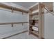 Walk-in closet with built-in shelves and hanging rods, perfect for organization and storage at 3427 Brunswick Ave, Indianapolis, IN 46227