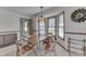 Dining area with a wooden table, comfortable seating, and view of nearby entry at 3427 Brunswick Ave, Indianapolis, IN 46227
