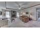 Bright living room with a brick fireplace, neutral carpet, and ample seating at 3427 Brunswick Ave, Indianapolis, IN 46227