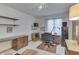 Inviting home office with a desk and built in cabinets and shelving provides ample storage at 3427 Brunswick Ave, Indianapolis, IN 46227