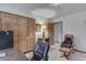 An office area features wood-look closet doors and a view into the hallway, complemented by a comfortable office chair at 3427 Brunswick Ave, Indianapolis, IN 46227