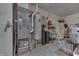 Utility room equipped with an HVAC system, water heater, and additional storage for household necessities at 3427 Brunswick Ave, Indianapolis, IN 46227