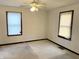 Bright bedroom featuring two windows and neutral walls and carpets, ready for personalization at 3434 Forrest Ter, Anderson SE, IN 46013