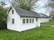 Exterior view of a white detached garage with windows, a door, and a gray roof at 3434 Forrest Ter, Anderson SE, IN 46013