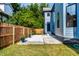 Backyard featuring a fenced yard, patio, grass, and professional landscaping at 3868 N Park Ave, Indianapolis, IN 46205