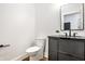 Modern powder room featuring sleek vanity with black hardware and stylish sink at 3868 N Park Ave, Indianapolis, IN 46205