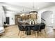 Dining area showcasing open layout with modern lighting and stainless steel appliances in kitchen at 3868 N Park Ave, Indianapolis, IN 46205