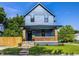 Charming two-story home featuring a covered front porch with brick supports and a well-maintained lawn at 3868 N Park Ave, Indianapolis, IN 46205
