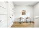 Hallway with seating area, modern art, and clean white walls at 3868 N Park Ave, Indianapolis, IN 46205