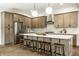 Spacious kitchen featuring a large island with seating, stainless steel appliances, and ample storage at 3868 N Park Ave, Indianapolis, IN 46205