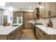 Contemporary kitchen with a spacious island, stainless steel appliances, and wooden floors at 3868 N Park Ave, Indianapolis, IN 46205