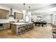 Modern kitchen features large island, stainless appliances, with open access to the dining area at 3868 N Park Ave, Indianapolis, IN 46205