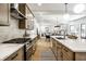 Modern kitchen with stainless steel appliances, quartz countertops and open floor plan at 3868 N Park Ave, Indianapolis, IN 46205