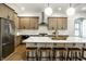 Spacious kitchen island with white countertops and ample seating, modern stainless steel appliances at 3868 N Park Ave, Indianapolis, IN 46205