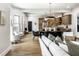 Bright and airy living room seamlessly connected to the dining area and modern kitchen at 3868 N Park Ave, Indianapolis, IN 46205