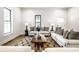 Comfortable living room featuring stylish decor, hardwood floors, and abundant natural light at 3868 N Park Ave, Indianapolis, IN 46205