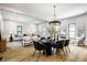 Open-concept living room and dining area, bathed in natural light with stylish furnishings at 3868 N Park Ave, Indianapolis, IN 46205