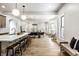 Open-concept living space with kitchen, dining, and seating areas, featuring natural light at 3868 N Park Ave, Indianapolis, IN 46205