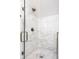 Beautiful glass shower with marble tiling and bronze hardware at 3868 N Park Ave, Indianapolis, IN 46205