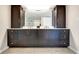 Elegant bathroom featuring double vanities, stylish cabinetry, and a large mirror at 4000 N Meridian St # Apt 15J, Indianapolis, IN 46208