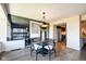 Elegant dining room with a modern chandelier, reflective wall decor, and wood flooring at 4000 N Meridian St # Apt 15J, Indianapolis, IN 46208