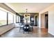 Stylish dining area featuring modern lighting and an open view to the outside through large windows at 4000 N Meridian St # Apt 15J, Indianapolis, IN 46208