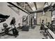 Well-equipped gym featuring various exercise machines, weights, and mirrors for a complete fitness experience at 4000 N Meridian St # Apt 15J, Indianapolis, IN 46208