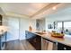 A modern kitchen featuring stainless appliances, a breakfast bar, and sleek countertops at 4000 N Meridian St # Apt 15J, Indianapolis, IN 46208