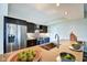 Well-equipped kitchen featuring sleek cabinetry, stainless steel appliances, and a large island at 4000 N Meridian St # Apt 15J, Indianapolis, IN 46208