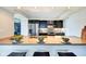 Kitchen with stainless appliances, a breakfast bar, and an open view to the dining area at 4000 N Meridian St # Apt 15J, Indianapolis, IN 46208
