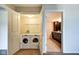 Convenient laundry room with a washer and dryer visible through the doorway at 4000 N Meridian St # Apt 15J, Indianapolis, IN 46208