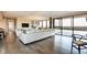 Open living space showcasing the living room, dining area, and access to the balcony at 4000 N Meridian St # Apt 15J, Indianapolis, IN 46208